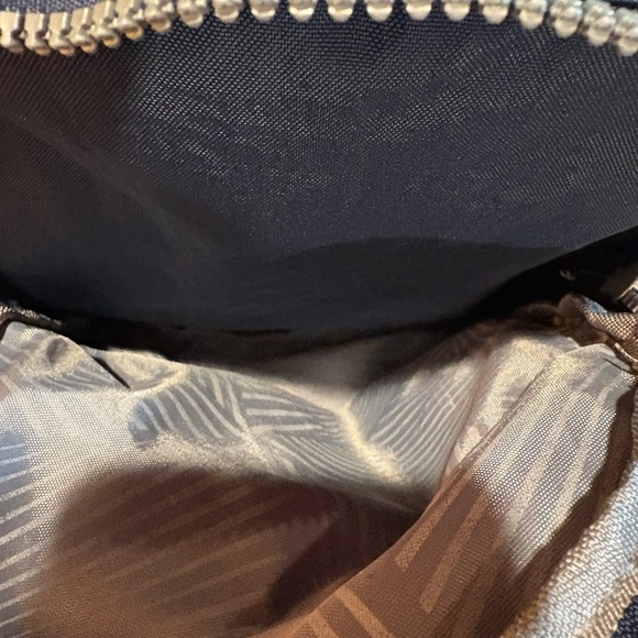 "Kaierwoke" backpack with silver zippers and a circular logo on the front - Picture 7 of 12